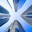 blue highrise glass skyscraper intersection low angle shot