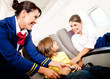Air hostess helping a kid