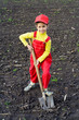 Little girl digs a big shovel