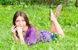 young woman resting on the meadow
