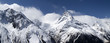 Panorama mountains in clouds. View from the ski slope. Panorama mountains in clouds. View from the ski slope.