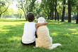 Photo: Tennager boy in the park with a dog Tennager boy in the park with a dog