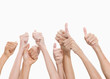 Thumbs up and hands raised