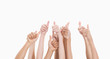 Five pairs of arms with the thumbs up 