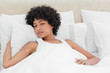 Curly haired woman waking up