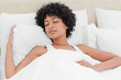 Curly haired woman sleeping peacefully 