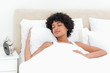 Woman with curly haired sleeping peacefully 