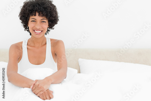 Photo: Portrait of a frizzy woman smiling Portrait of a frizzy woman smiling
