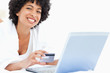 Happy woman using a laptop for shopping