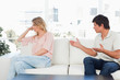 Foto: Man pleading with the woman who is turned away not interested Man pleading with the woman who is turned away not interested