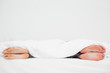 Man and woman's feet in bed turned away from each other