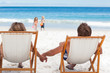 Parents watching their children walking at the beach