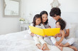 The parents read their children a bedtime story