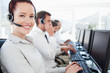 Women looking forward and smiling with her business co workers