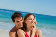 Man embracing his girlfriend listening into a starfish 