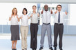 Business team giving a thumbs up