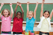 Cheering students standing in classroom