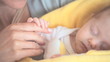 Video: Woman holding her baby's hand Woman holding her baby's hand