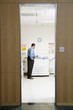 Rear view businessman at copy machine