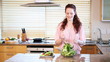 Young woman mixing a salad