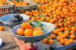 Fresh mandarin citrus fruits on a market stand