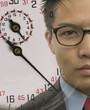 Young businessman with superimposed stopwatch image