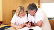 Father using a protractor with his son