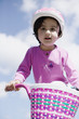 Preschool girl riding bicycle