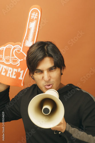 Photo: Portrait of man with bull horn and foam hand Portrait of man with bull horn and foam hand