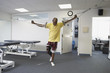 Man walking with crutches in air