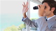 Businessman businessman looking through binoculars while waving