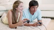 Woman winning in a video game against her boyfriend