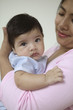 Portrait of mother holding baby