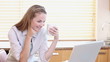 Video: A housewife watching a video on a laptop A housewife watching a video on a laptop
