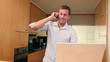 Man on the phone while using a laptop