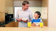 Father and son eating breakfast