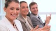 Business people applauding together