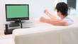 Man watching the television while speaking
