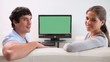 Couple sitting together in front of the television