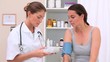 Practitioner taking the blood pressure of a patient