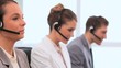 Video: Smiling business people working with headsets Smiling business people working with headsets