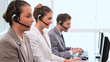 Call centre agents working with computers