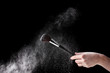 Make up brush with powder isolated on black