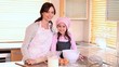 Smiling mother and daughter standing upright
