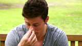 Video: Disappointed man putting his face in his hands while shaking his head as he sits on a bench Disappointed man putting his face in his hands while shaking his head as he sits on a bench