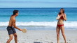 Playful couple playing with paddles