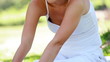 A woman performing yoga in the park
