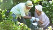 Old people watering plants in slow motion