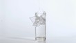 Cube falling in super slow motion breaking the glass