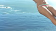 Young woman in slow motion falling in the water